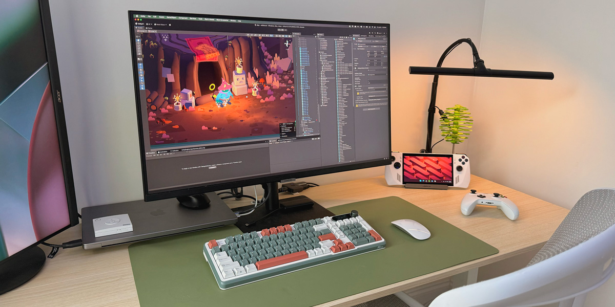 My desktop featuring a MacBook Pro and the Rog Ally